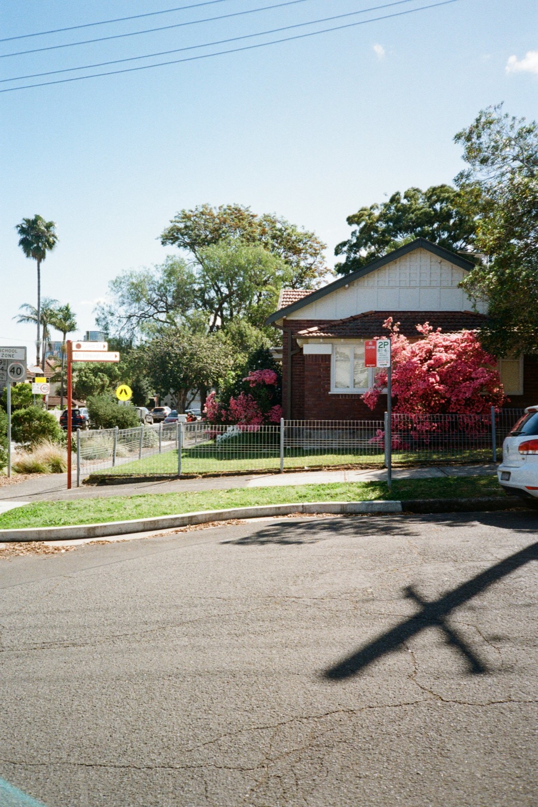 A suburban shopping strip with real estate offices